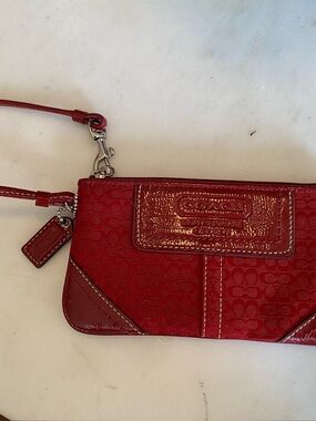 Coach Red Signature Wristlet with Patent Trim with hang tag.